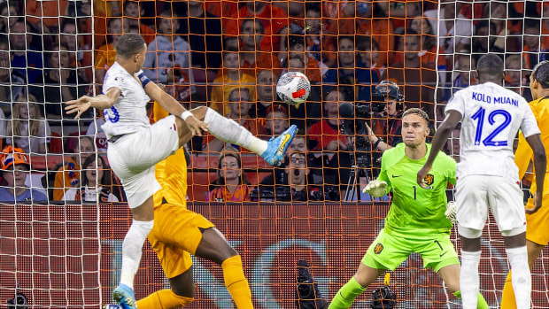 Kylian Mbappe pictured volleying the ball to score his 41st international goal for France during a Euro 2024 qualifier against the Netherlands in October 2023